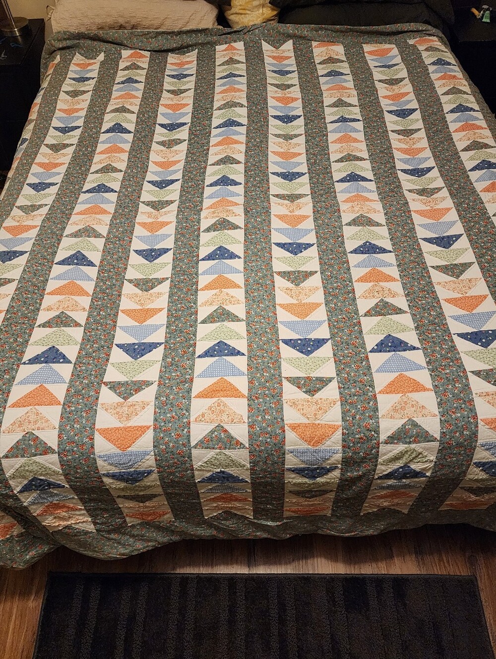 Vintage handmade flying geese quilt